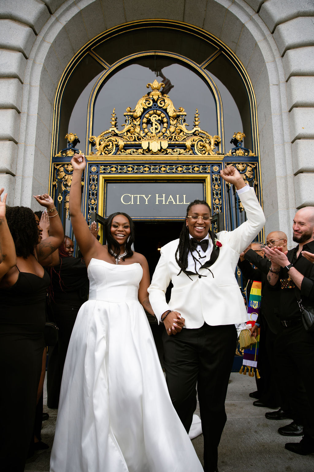 Galen and Jae posing in front of city hall.