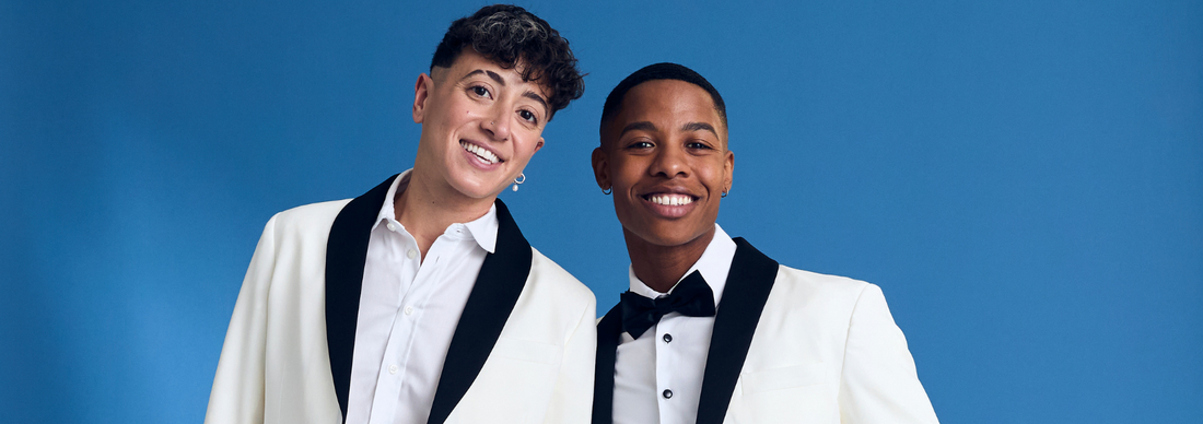 Two models wearing the Ivory Kirrin Tuxedo with a blue background.