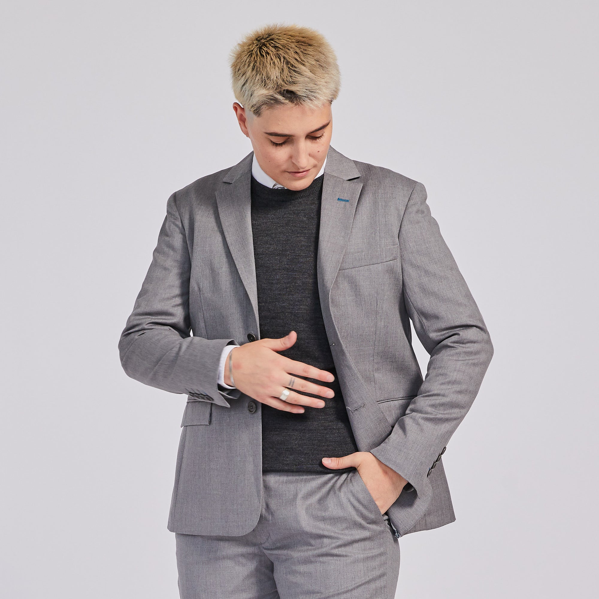 Ribbed Charcoal Merino Wool Sweater paired with Light Gray suit blazer. Color: Charcoal