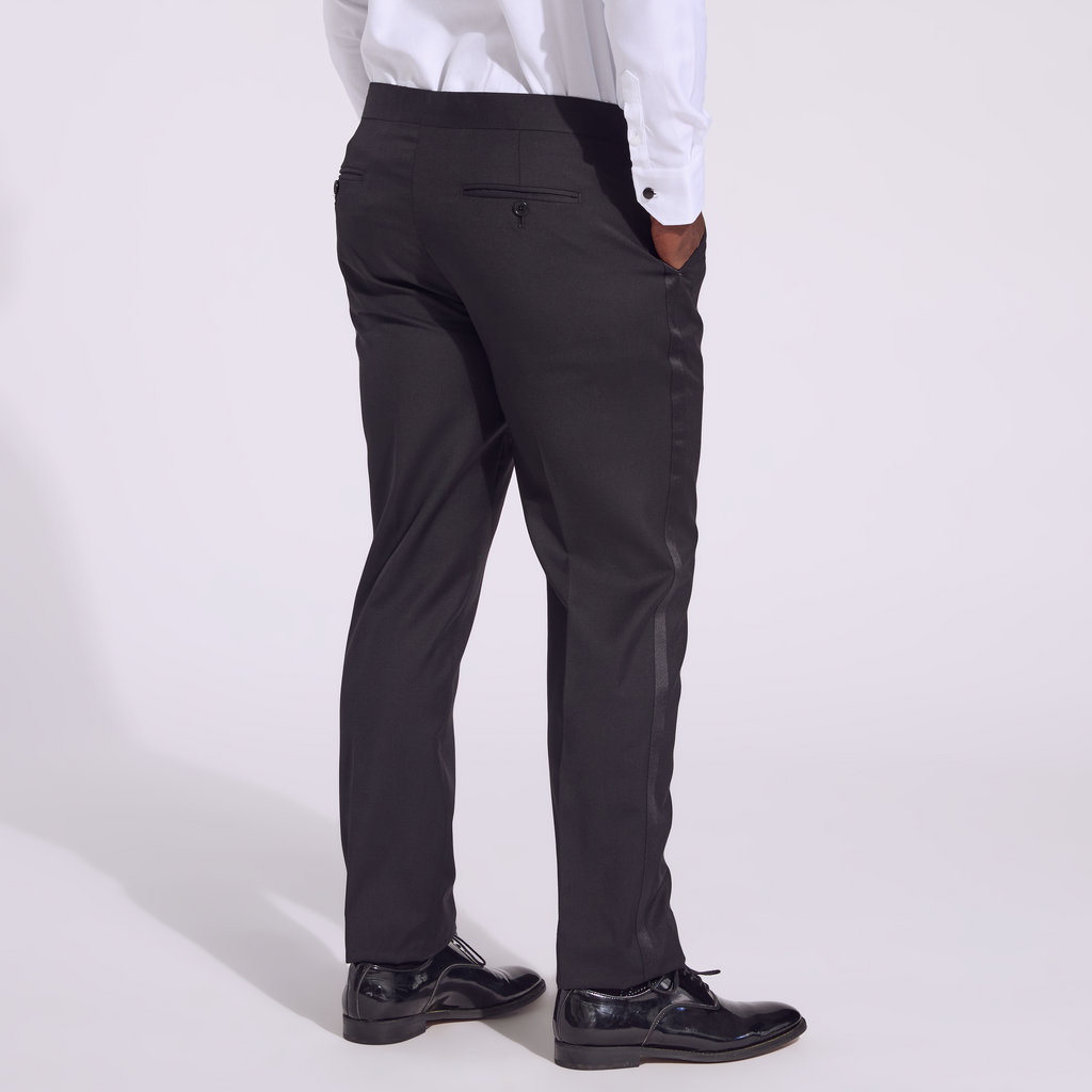 Transmasc model wearing Noir Tuxedo pants by Kirrin Finch. Color: Noir