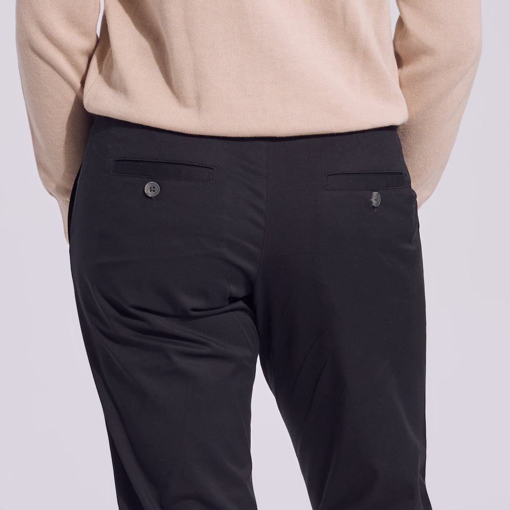Black chinos with back pocket buttons. Color: Black