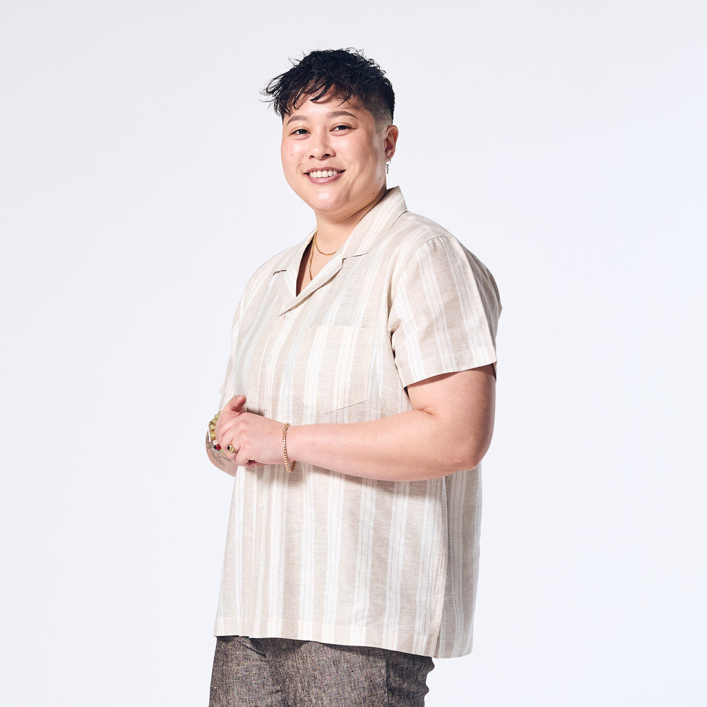 Androgynous Sand Wide Stripe Linen Camp Shirt. Color: Sand Wide Stripe