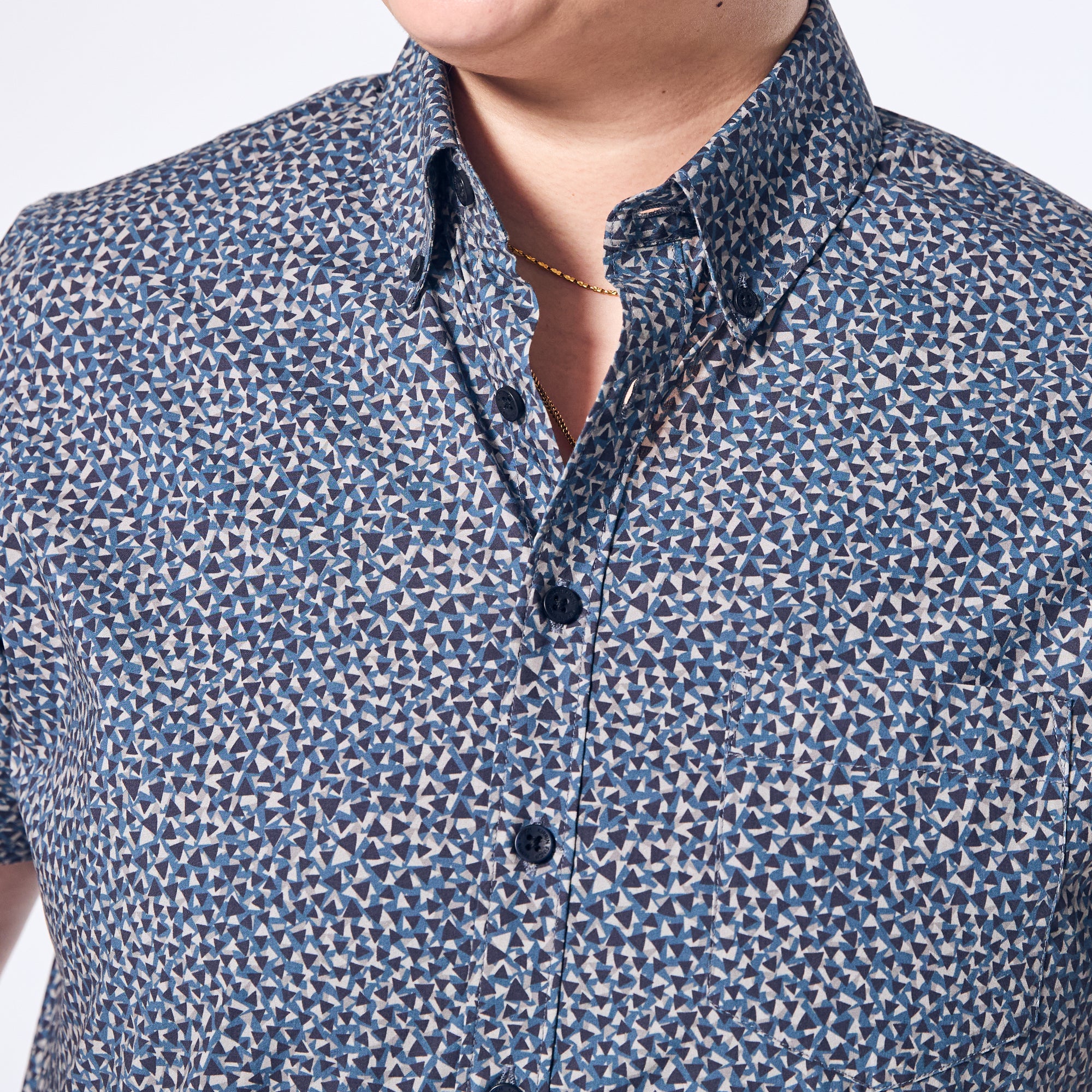 Patterned short sleeved button up shirt featuring black Kirrin Finch logo buttons. Color: Tri-Fusion