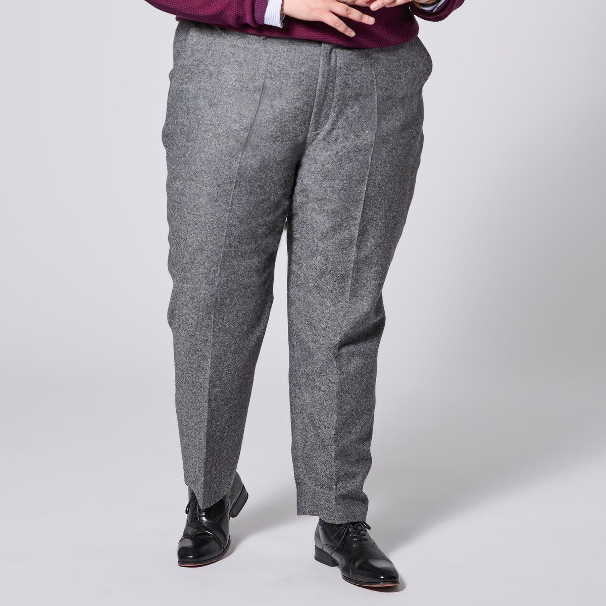 Finch Smokey dress pants worn by a person on a white background.  Color: Smokey