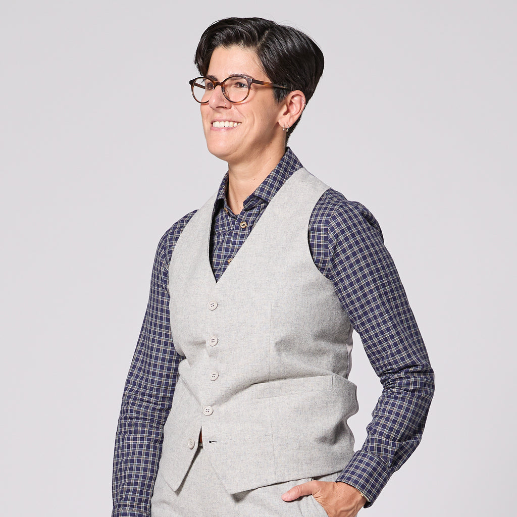 Model wearing the Heather Gray Flannel  vest on a solid white background. Color: Heather Gray Flannel