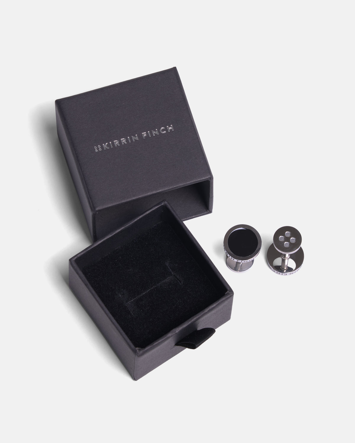 Pair of silver and black cufflinks featuring Kirrin Finch name and logo with gift box.