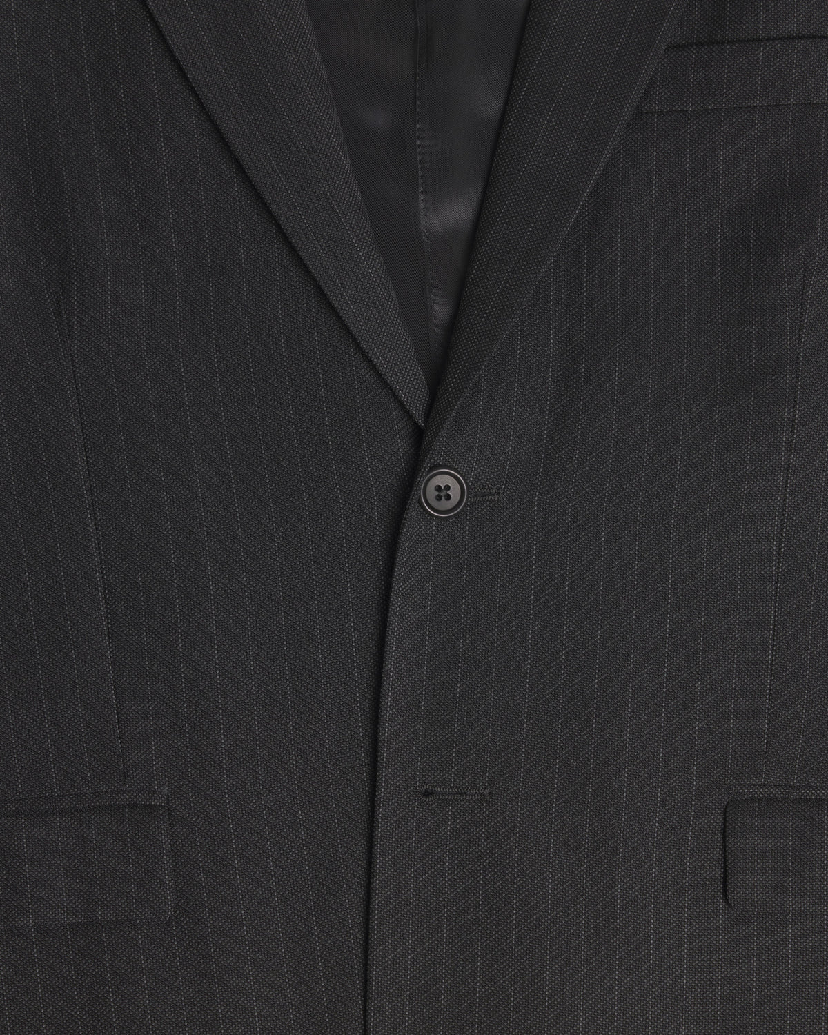 Close-up of a dark charcoal gray pinstripe suit jacket, showing the fine vertical stripes, a single button closure, and the lapel. Color: Shadow Pinstripe