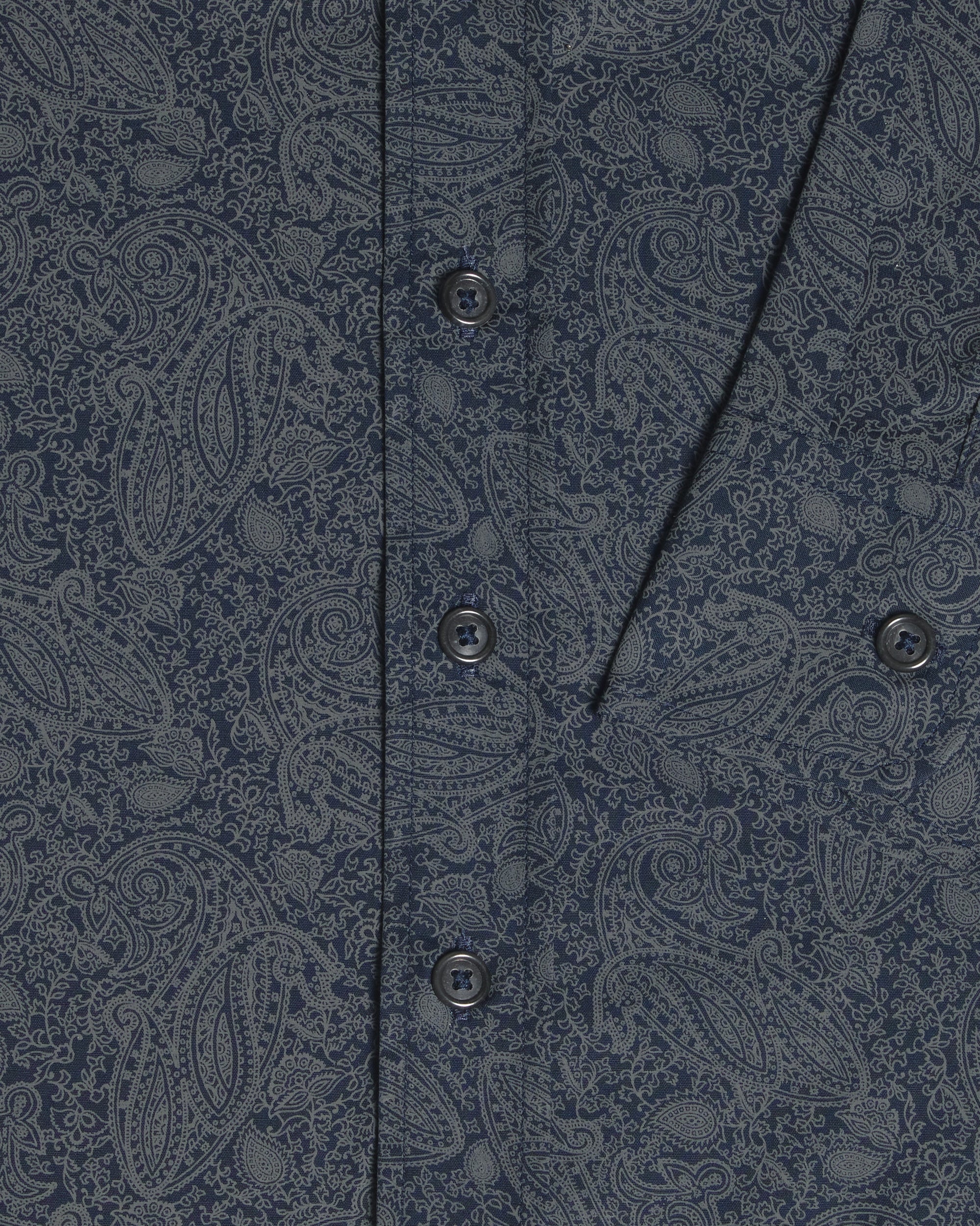 Close-up of a navy blue button-down shirt with a detailed gray paisley pattern, featuring a vertical button placket. Color: Midnight Paisley