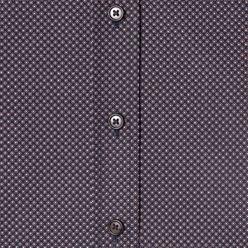 Patterned shirt with buttons on a white background made by Kirrin Finch. Color: Moroccan Tile