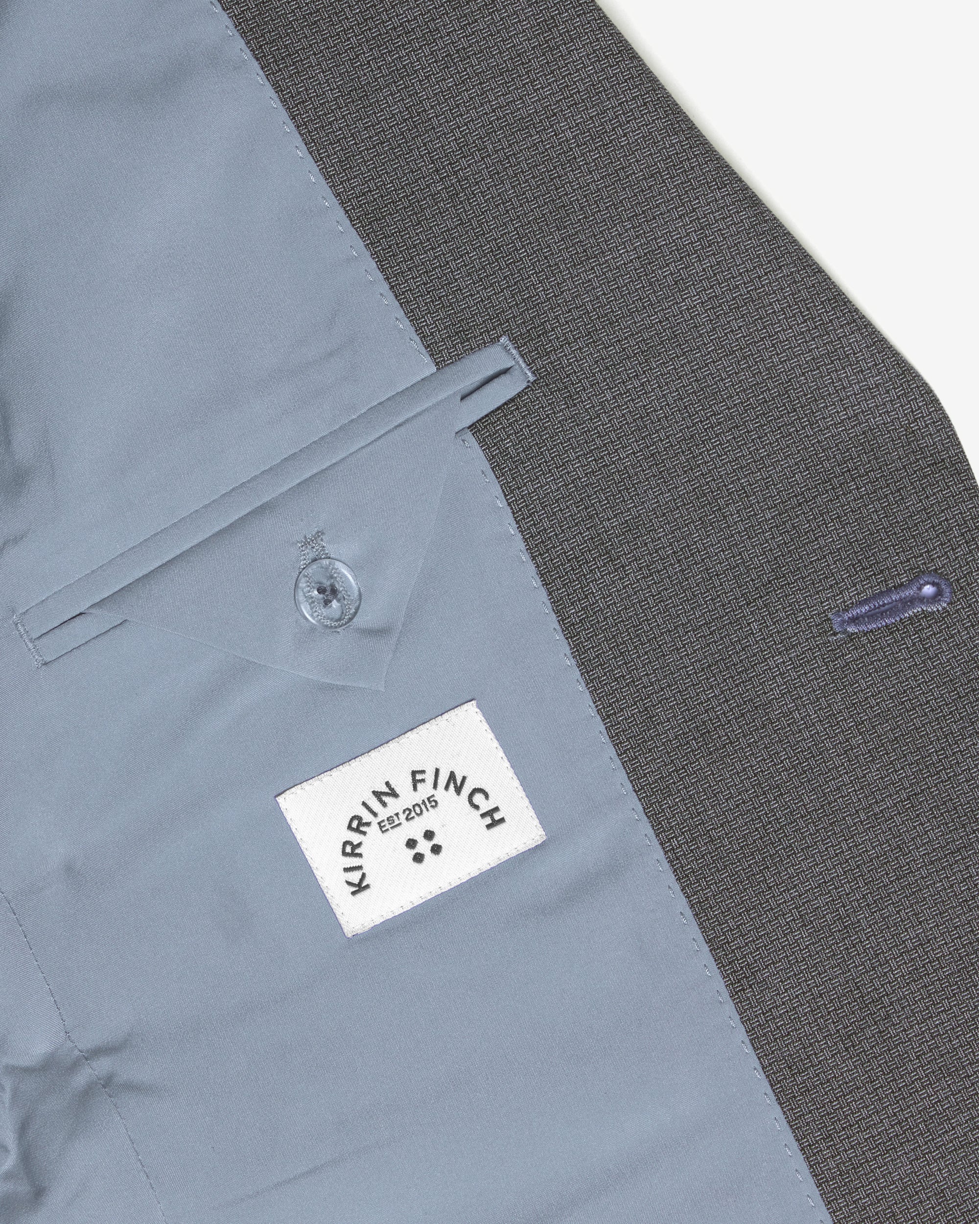 Close-up of the inner pocket of the scout blazer. Color: Gray Lattice