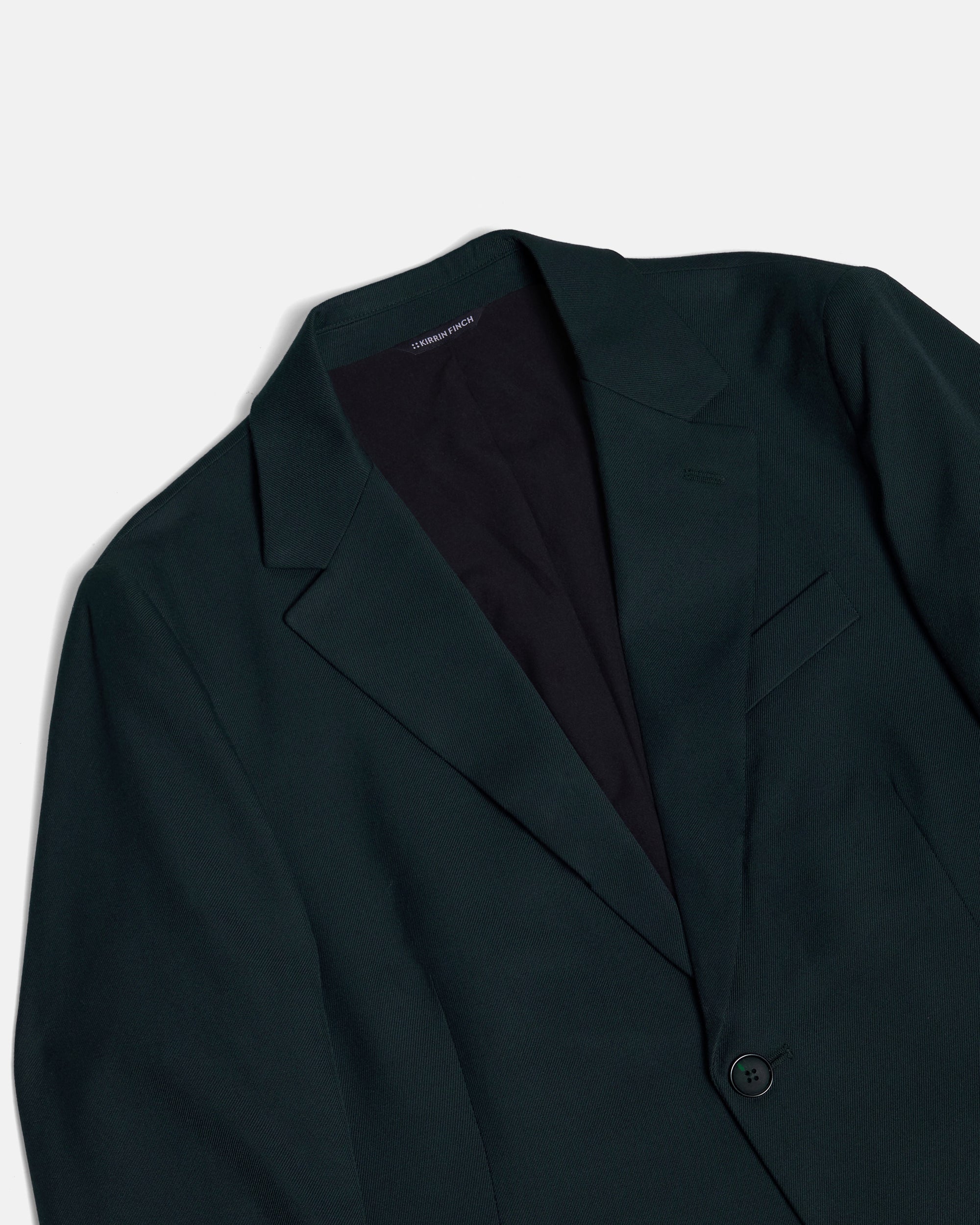 Dark green blazer on a light gray background. Color: Phantom Green Twill
