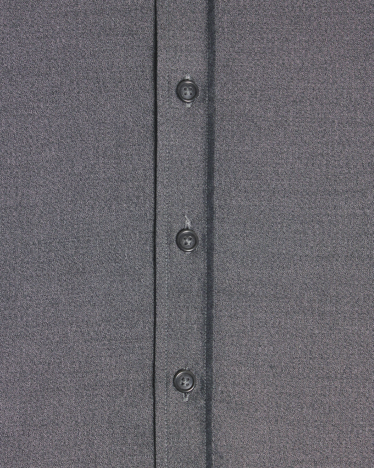 Close-up of a dark gray textured fabric garment showing a vertical button placket with four dark buttons. Color: Steel Marl Herringbone