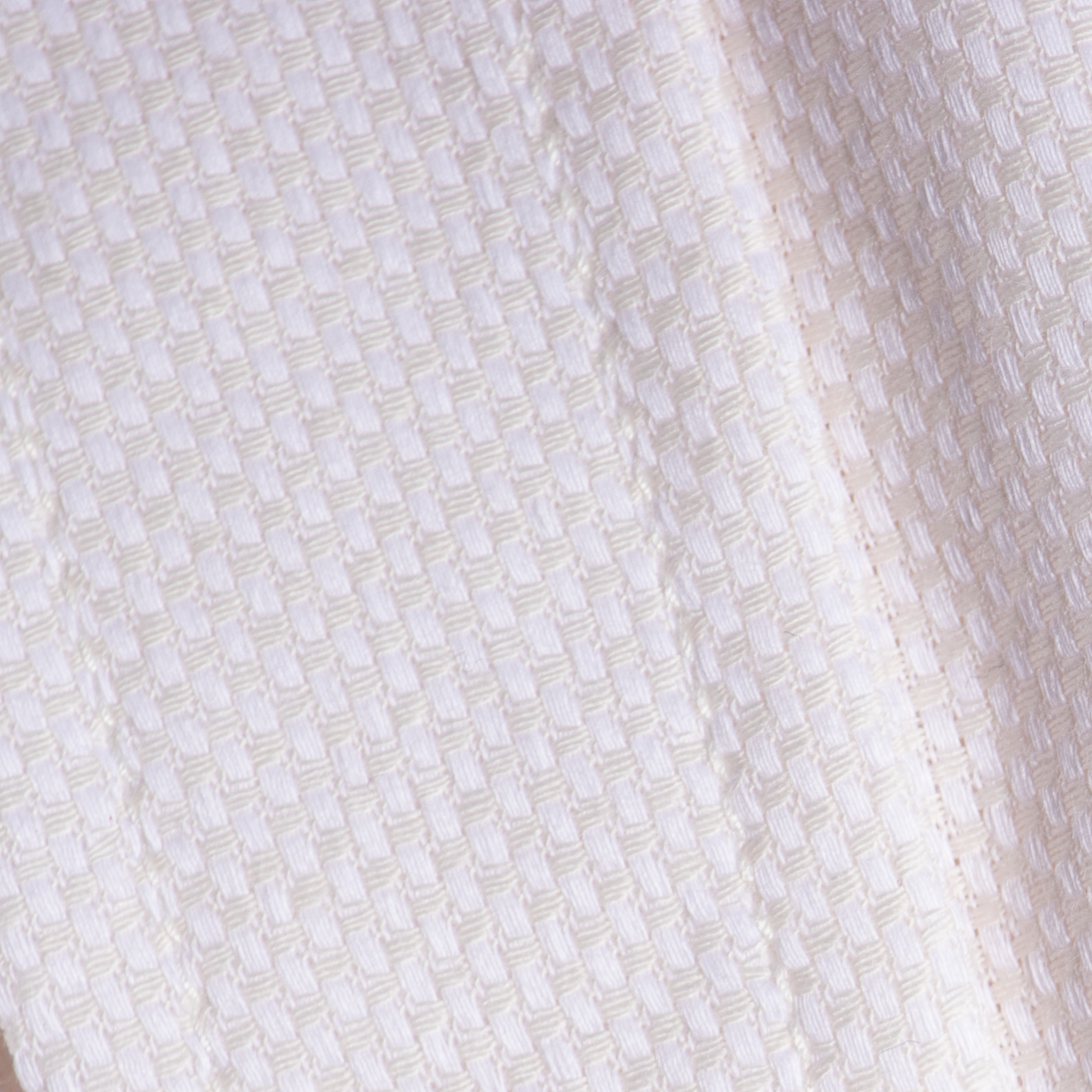 Close up shot of the Ivory Basketweave Frankie dress shirt made for women.  Color: Ivory Basketweave
