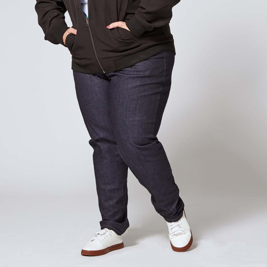 Plus size denim jeans paired with reversible bomber. Color: Indigo